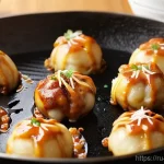 Home 14 오사카 타코야키 제대로 만드는 법 - **Prompt 1: The Art of Flipping Takoyaki**
A dynamic, close-up shot of a takoyaki pan filled wit...